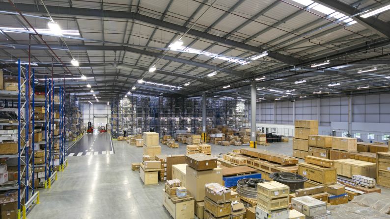 Aviation parts warehouse with stored components and shipping crates